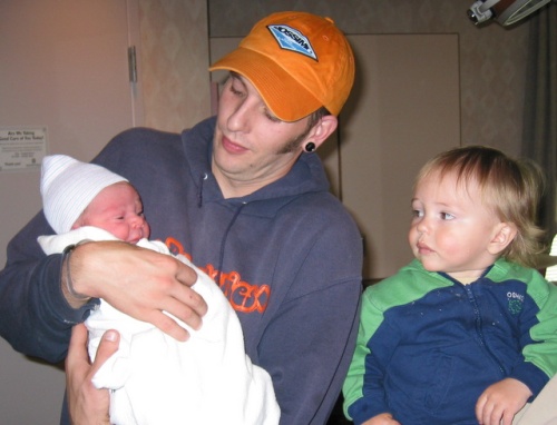 A better picture of Beau from 5 years ago holding newly born Orion and older brother Luke...